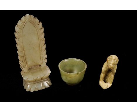 A Chinese carved mutton fat jade sculpture of a high backed throne, with lotus petal detailing, 10.5cms high; together with t