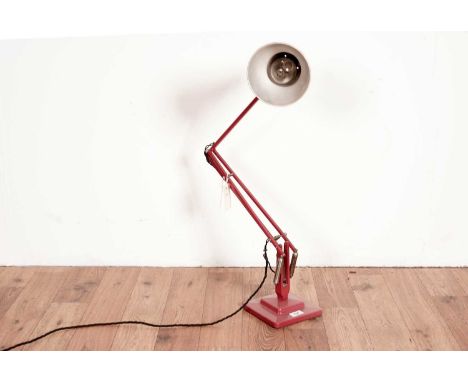 Herbert Terry: A vintage red metal angle poised lamp.