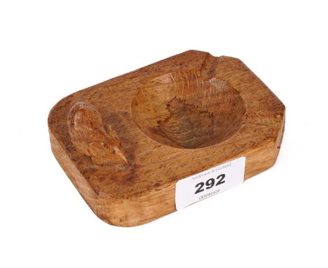 A Robert ‘Mouseman’ Thompson carved oak ashtray, of rectangular form, with mouse figure in high relief, 10.5cms wide.
