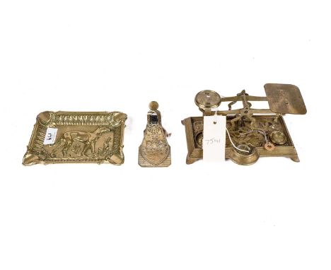 A set of 19th Century ornate brass postal scales, with scrolling design to its base and flowers to the spaces for the weights