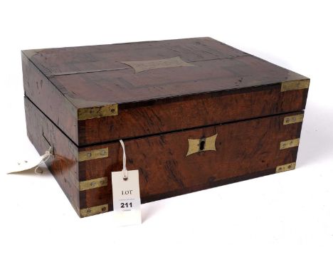 A 19th Century walnut writing slope with inlaid borders, brass mounts and hinges, the hinged lid with a brass cartouche inscr