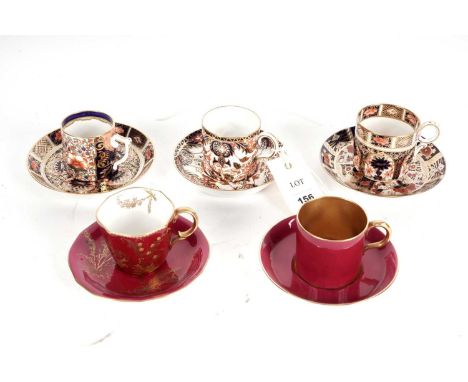 Three Royal Crown Derby ‘Imari’ pattern coffee cups and saucers, various pattern numbers and date cyphers; together with two 