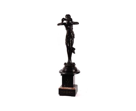 An early 20th Century bronze figure of a fairy, modelled holding a pan flute, with a large leaf draped around her waist, stan