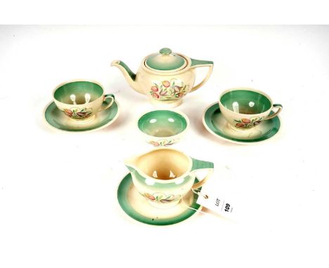 A Susie Cooper Production for Crown Works Burslem tea service, comprising: two teacups and saucers, a tea pot, a sugar bowl, 