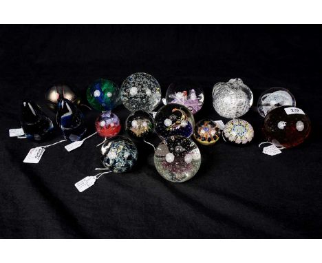 A Caithness 'Deco Drops' glass paperweight; together with a selection of other glass paperweights, by makers including Wedgwo