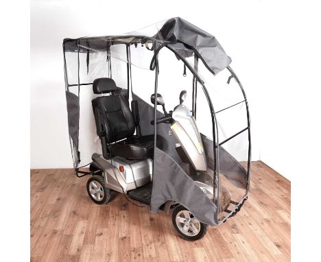 A Kymco Maxer mobility scooter with rain cover.