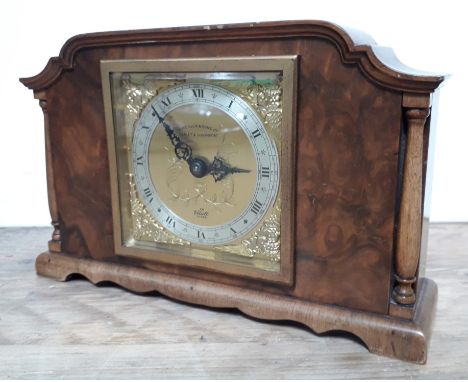 A reproduction burr walnut mantle clock by Elliott, length 22cm.  