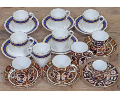 A matched set of Royal Crown Derby and Shelley Celtic coffee cans and saucers.  