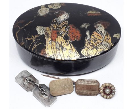 A Japanese lacquer oval snuff box and contents comprising a pair of 9ct on silver cufflinks and a yellow metal pin set with h