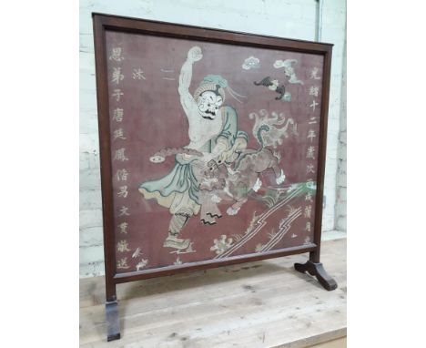 A Chinese embroidered panel depicting a warrior fighting a dragon with two bats above and characters down each side, image 77