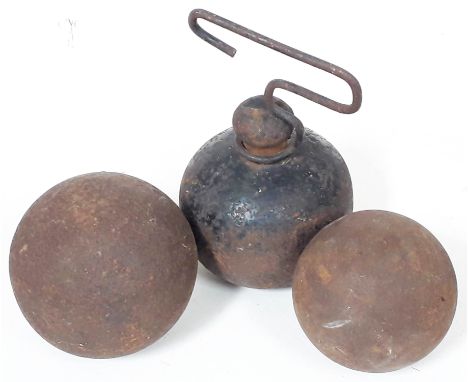 Two cannon balls and a cast iron door stop.  