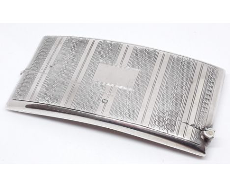 An Art Deco style silver card case of curved form, Joseph Gloster, Birmingham 1927, length 83mm, wt. 49.3g.  