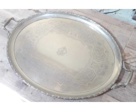 A large silver plated tray of oval form with twin handles, length 71.5cm.  