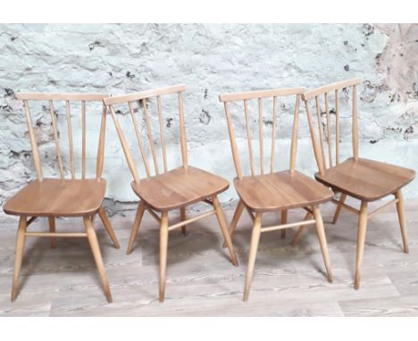 A set of four Ercol blonde elm and beech chairs.  