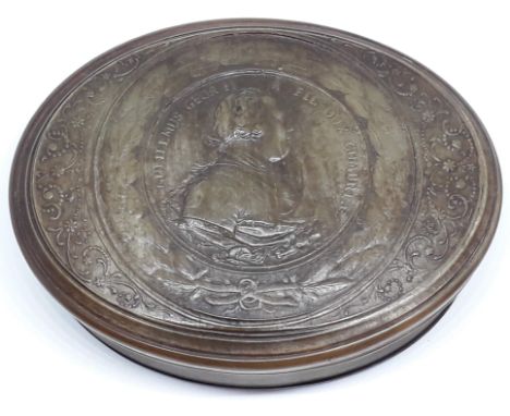An 18th century horn snuff box embossed with George II head in profile with wreath and floral border, length 10cm.  With acco