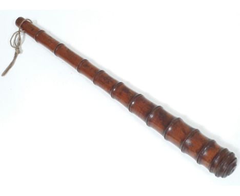 A Victorian oak bamboo effect and weighted truncheon or cosh, length 39.5cm.  