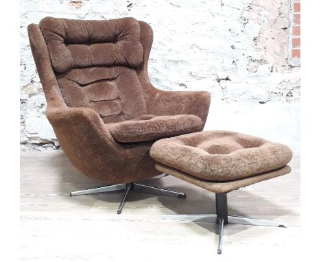 A retro brown velour egg chair and matching stool.Condition: one button missing to stool, underlining to stool loose in areas