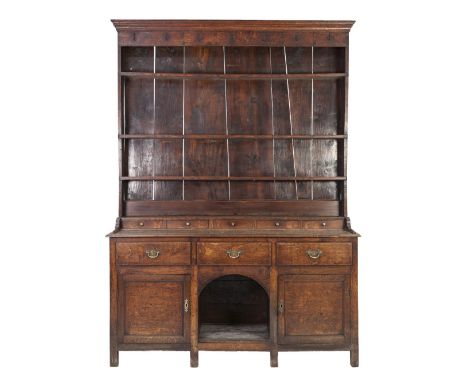 LATE EIGHTEENTH/ EARLY NINETEENTH CENTURY OAK SMALL DRESSER WITH PLATE RACK, the moulded cornice above bent nail hooks to the