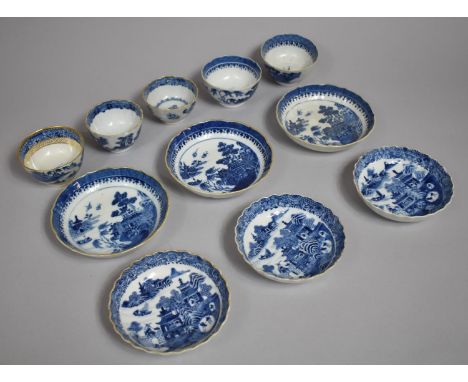 A Collection of 18th/19th Century English Blue and White Porcelain Tea Bowls and Saucers. Oriental River Village Scene and On