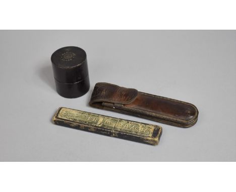 An Early 20th Century Leather Case Containing Two Cut Throat Razors, a Fram Razor and a Vintage Cased Medicine Glass