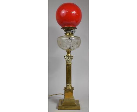 A Victorian Brass Oil Lamp, The Support in the Form of a Ribbed Corinthian Column on Stepped Square Base Cut Glass Reservoir 