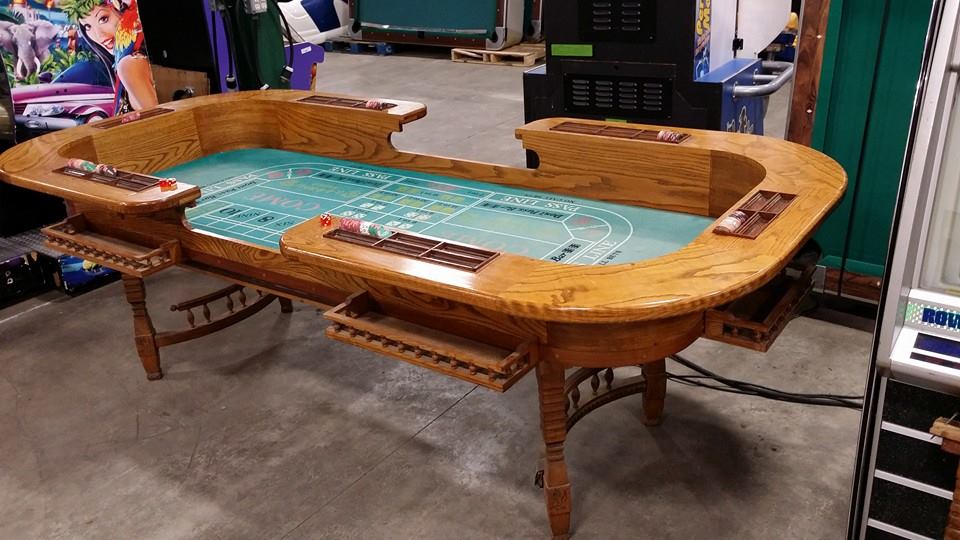 Used item Vintage craps table with clay chips and dice.