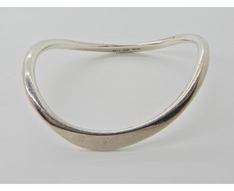 A silver Georg Jensen bangle internal dimensions 6.2cm x 5.2cm, weight 28.6gms