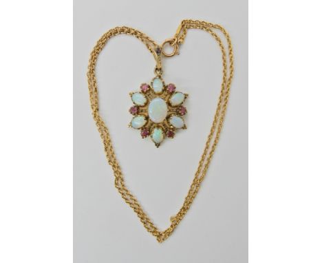 A 9ct gold opal and red gem pendant length 4cm, with a 15ct gold chain length 46cm