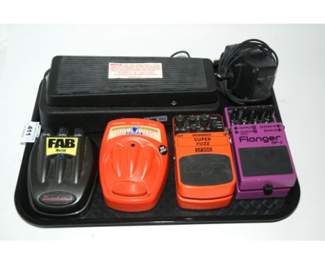Five guitar effect pedals including a Dunlop Cry Baby GCB-95 , a Boss Flanger BF-3 with an AC adaptor, a Behringer Super Fuzz