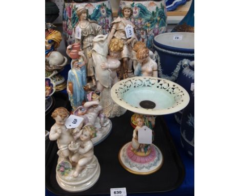 A collection of Royal Worcester figures including cherubs, a pair of water carriers, tazza and other figures (some damage and