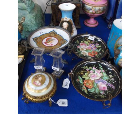 A pair of porcelain dishes on metal stands, painted with flowers, a pair of Baccarat urns on stands, together with a portrait