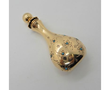 A 14k gold John Rubel perfume flask, with floral pattern set with turquoise, and garnets to the lid. Dimensions 6cm x 2.6cm x