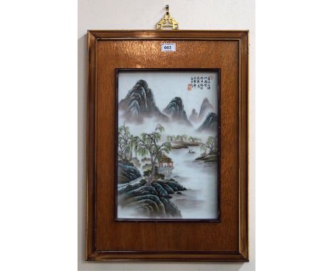 A Chinese ceramic panel, painted with a mountainous landscape, 55.5cm long