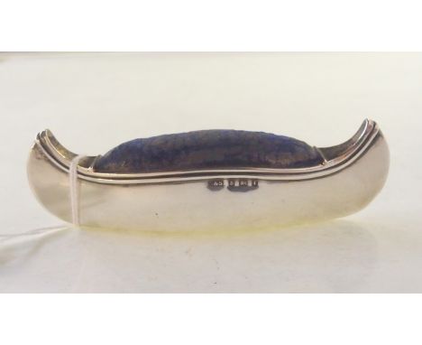 A novelty silver pin cushion modelled as a canoe, Birmingham 1905, 9.5cm long