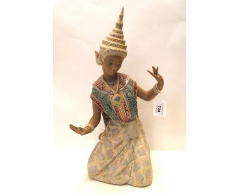 A Lladro figure of a kneeling Thai dancer