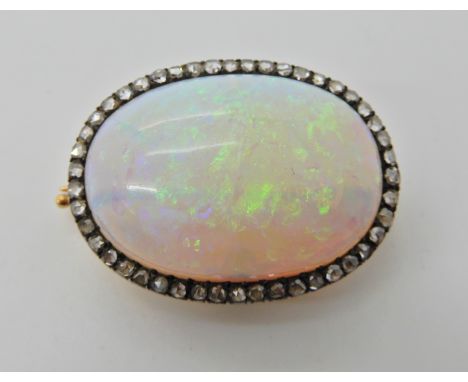 A Continental large white opal and rose cut diamond brooch, with a screw on converter to turn it into a pendant. Dimensions o