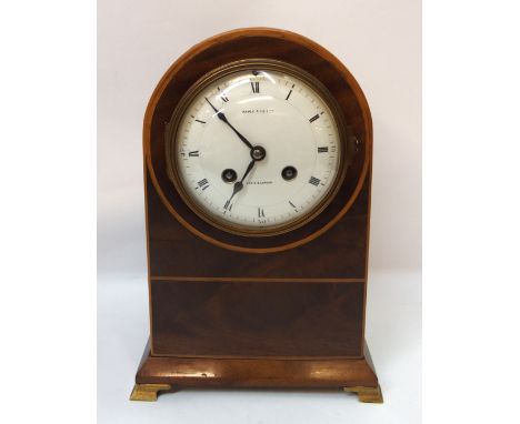 A Maple and Co mahogany dome top mantle clock, on brass feet, 25.5cm high