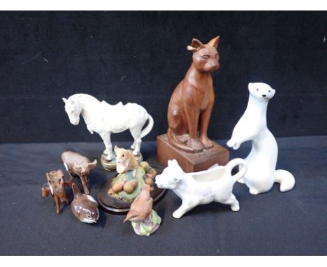 A SOVIET ERA RUSSIAN OTTER MODEL with a collection of animal and bird models in ceramic and wood, including a carved wood Egy