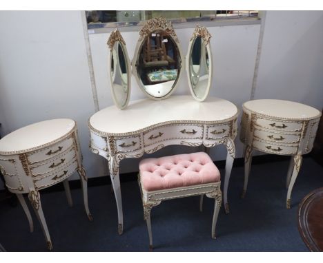 A LOUIS XV STYLE WHITE-PAINTED AND PARCEL GILT BEDROOM SUITE 20th century, to include kidney shaped dressing table and mirror