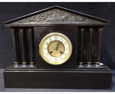 A SLATE MANTEL CLOCK, OF ARCHITECTURAL FORM with columns and pediment, French movement striking on a gong 42cm wide