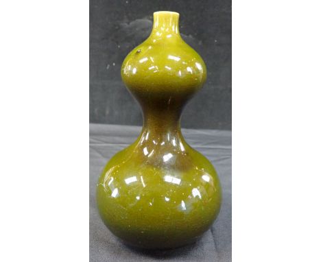 A LINTHORPE POTTERY DOUBLE GOURD VASE designed by Dr Christopher Dresser, with green glaze, design No. 142, 22cm high (glaze 