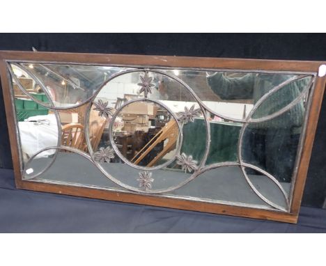 A 19TH CENTURY MIRROR WITH CAST LEAD GLAZING BARS with conforming shaped plates, set in a mahogany frame 47 x 95cm (some 'fox