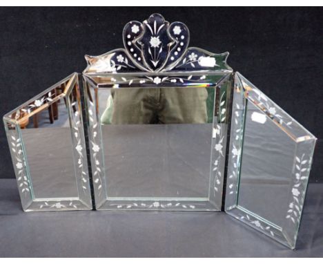 A THREE FOLD DRESSING TABLE MIRROR OF VENETIAN DESIGN with etched and bevelled borders, 38cm high x 57cm wide 