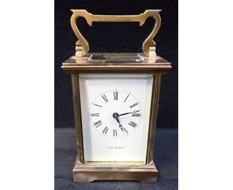 A BRASS CARRIAGE CLOCK the dial signed 'JEAN RENET' 11.5cm high plus handle