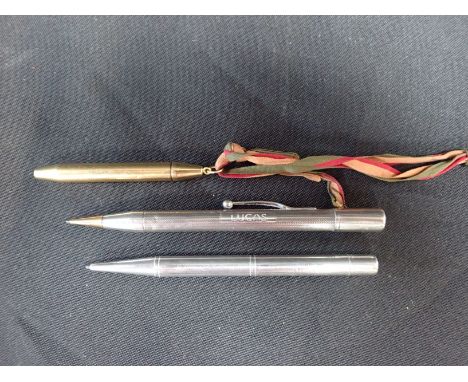 A SILVER 'BAKER'S POINTER' PENCIL a similar sterling silver pencil with engine turned decoration, and a rolled gold pencil st