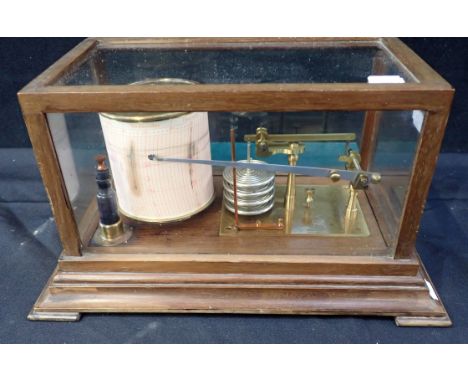 A 20TH CENTURY BAROGRAPH BY ARMY &amp; NAVY in glazed mahogany case, 19cm high, with spare papers for same 