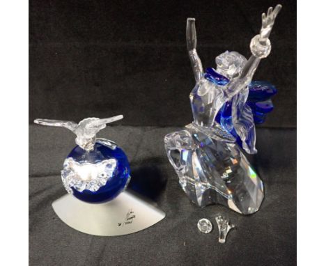 A SWAROVSKI SILVER CRYSTAL FIGURE 'CRYSTAL PLANET VISION 2000' with integral plinth, 12cm high and a Swarovski crystal figure