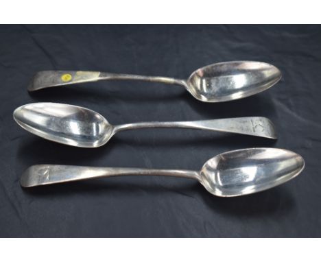 Three George II silver Old English pattern table spoons, the terminals engraved with crest 'A Dexter arm embowed in armour ho