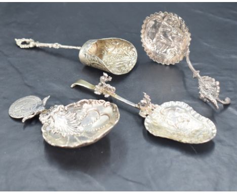 A George V imported Hanau silver ornamental 'Monkey' spoon, the shaped sallow bowl embossed with stag hunting scene, the spre