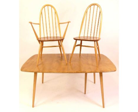 An Ercol blond elm dining suite, comprising; Grand Windsor 510 dining table with pull-out action, twin folding leaf, raised o